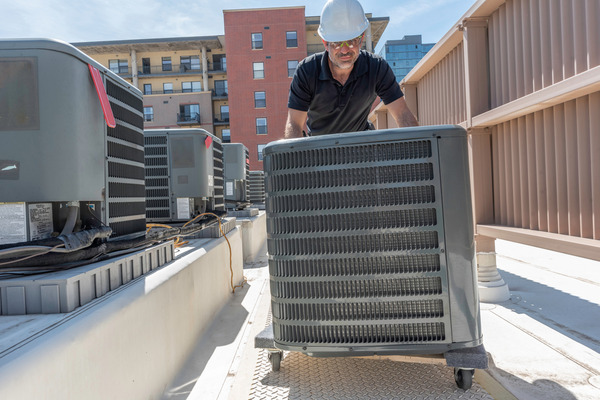 Best HVAC replacement services company in Fort Lauderdale FL - A picture of Filterbuy HVAC technician doing an HVAC replacement service in Fort Lauderdale FL