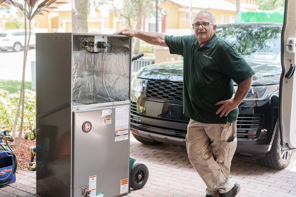 Best HVAC installation services company in Tamarac FL - A picture of Filterbuy HVAC technician doing an HVAC installation service in Tamarac FL